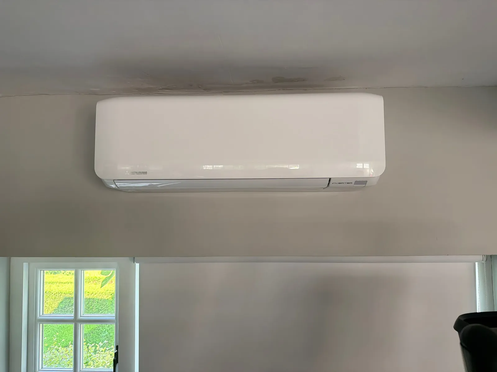 Daikin wall-mounted AC unit above a doorway
